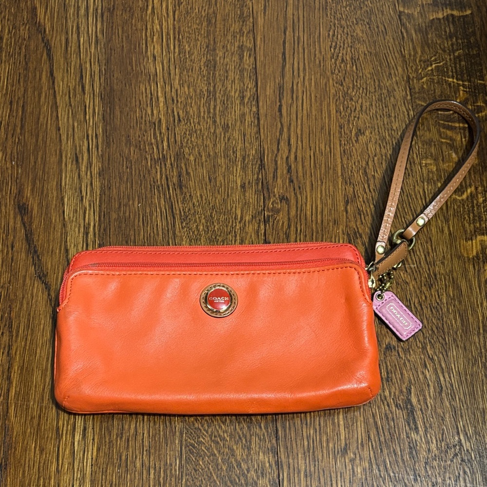 Coach Orange Leather Wristlet with Pink Charm and Brown Strap